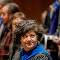 Samhita Rhodes looks on to others in the crowd